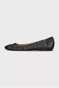 Black ballet flats made of fabric and leather with a print