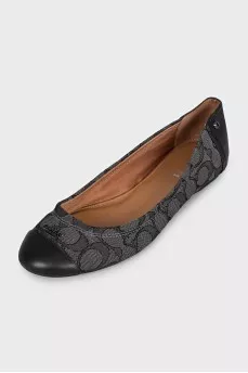 Black ballet flats made of fabric and leather with a print