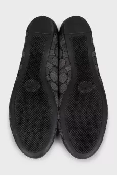 Black ballet flats made of fabric and leather with a print