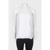 White sleeveless top with tag