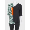 Asymmetric collar and contrasting print top