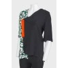Asymmetric collar and contrasting print top