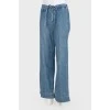 Loose cut jeans with belt