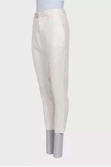 White tapered trousers with elastic waistband