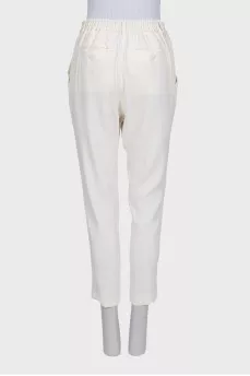 White tapered trousers with elastic waistband