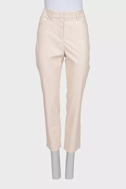Beige tapered trousers made of eco-leather