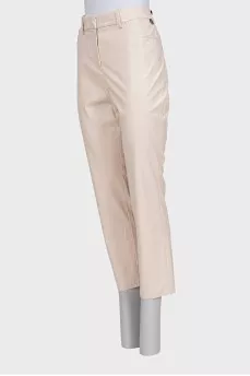 Beige tapered trousers made of eco-leather