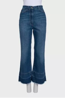 Blue flared jeans with fringe