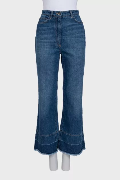 Blue flared jeans with fringe