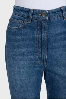 Blue flared jeans with fringe
