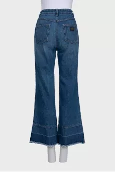 Blue flared jeans with fringe