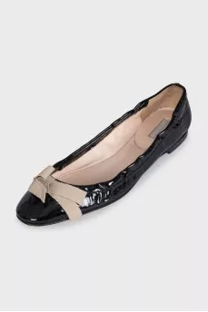 Patent leather ballet flats with a bow