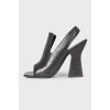 Black leather heeled shoes with open heel and toe