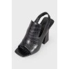Black leather heeled shoes with open heel and toe