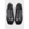 Black leather heeled shoes with open heel and toe
