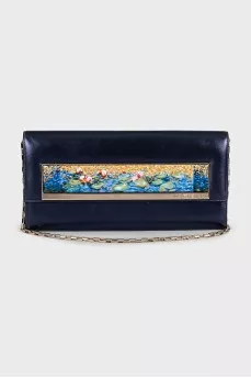 Blue leather clutch decorated with enamel