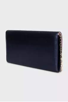 Blue leather clutch decorated with enamel