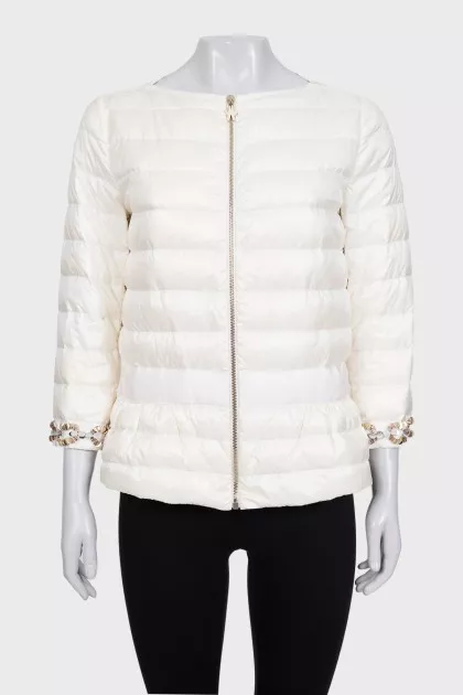 White quilted down jacket with decorative sleeves