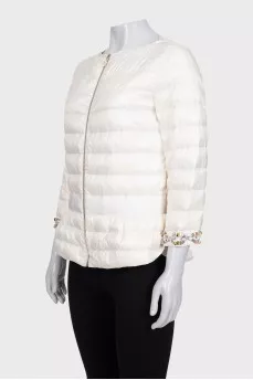 White quilted down jacket with decorative sleeves