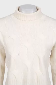 White turtleneck sweater with a textured pattern