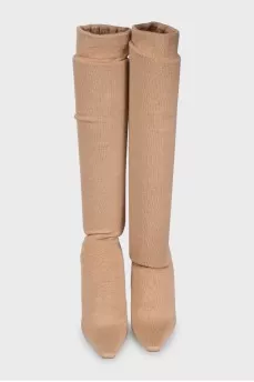 Beige textile boots with a decorated heel