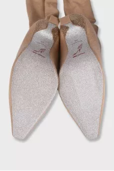 Beige textile boots with a decorated heel