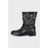Black leather boots with metallic decor