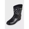 Black leather boots with metallic decor