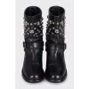 Black leather boots with metallic decor