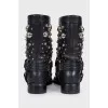 Black leather boots with metallic decor
