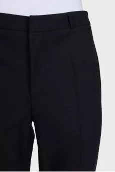 Black straight-leg trousers with creases