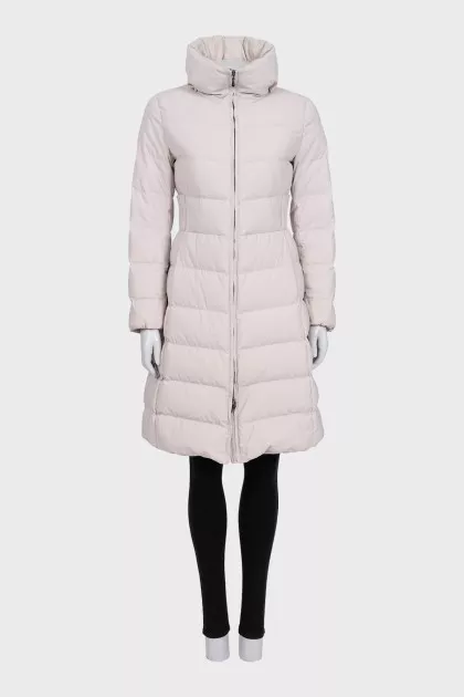 A fitted, elongated down jacket with a zipper