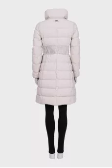A fitted, elongated down jacket with a zipper