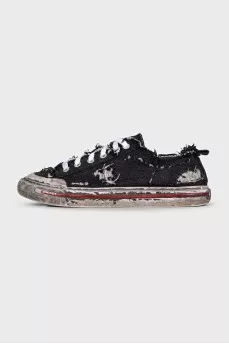 Textile sneakers with a distressed effect