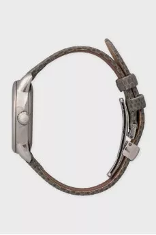 Silver watch with a green leather strap