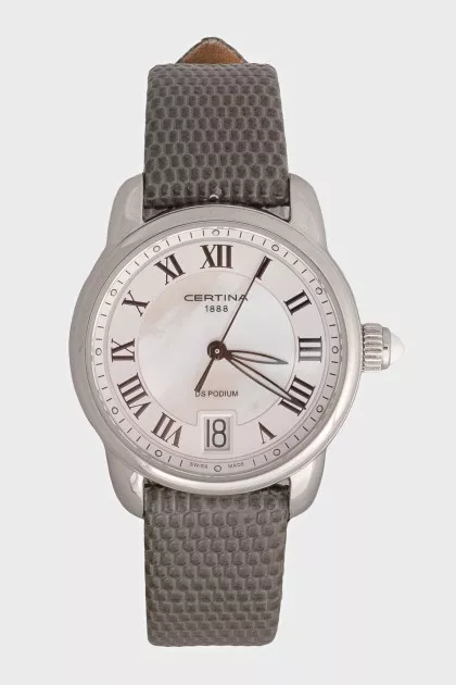 Silver watch with a green leather strap