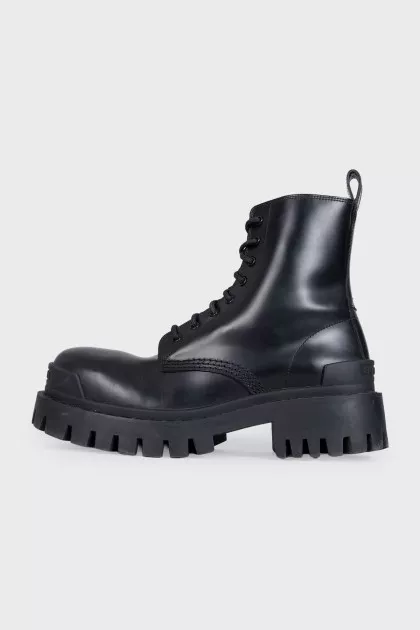 Black leather boots with chunky soles