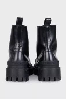 Black leather boots with chunky soles