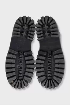 Black leather boots with chunky soles