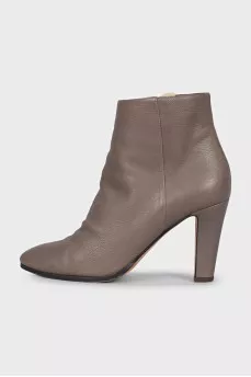 Gray ankle boots with a gold zipper