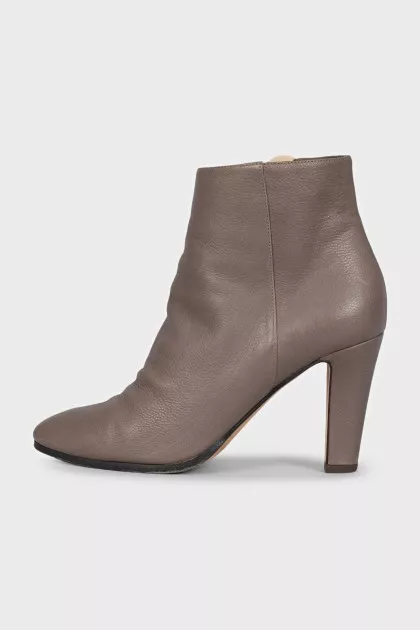 Gray ankle boots with a gold zipper