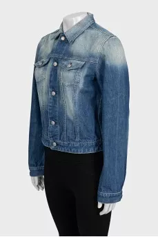 Blue cropped denim jacket with a distressed effect