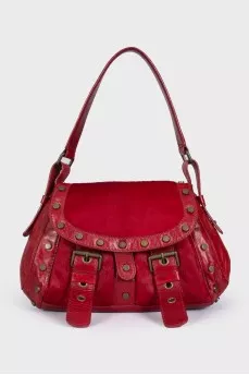 Bag made of fleecy leather decorated with rivets