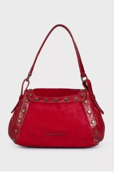 Bag made of fleecy leather decorated with rivets