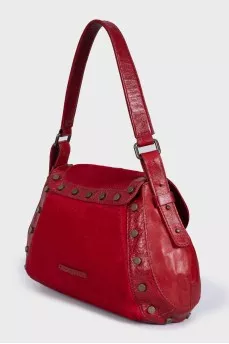 Bag made of fleecy leather decorated with rivets