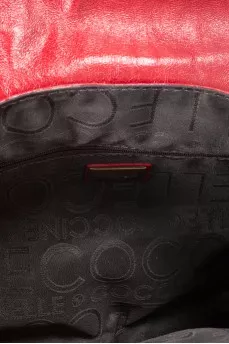 Bag made of fleecy leather decorated with rivets