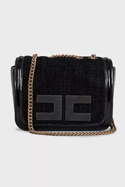 Black bag with a textile logo