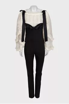 Black jumpsuit with white silk top