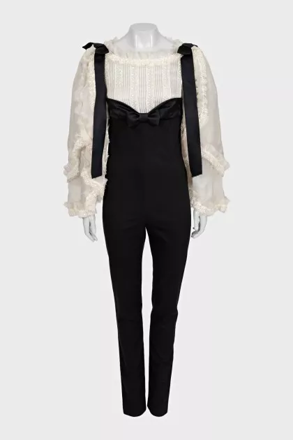 Black jumpsuit with white silk top