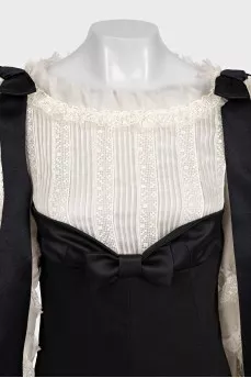 Black jumpsuit with white silk top